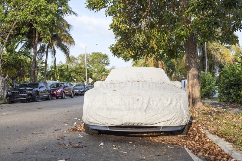 Car underneath a car cover stock photo. Image of protect 89832522