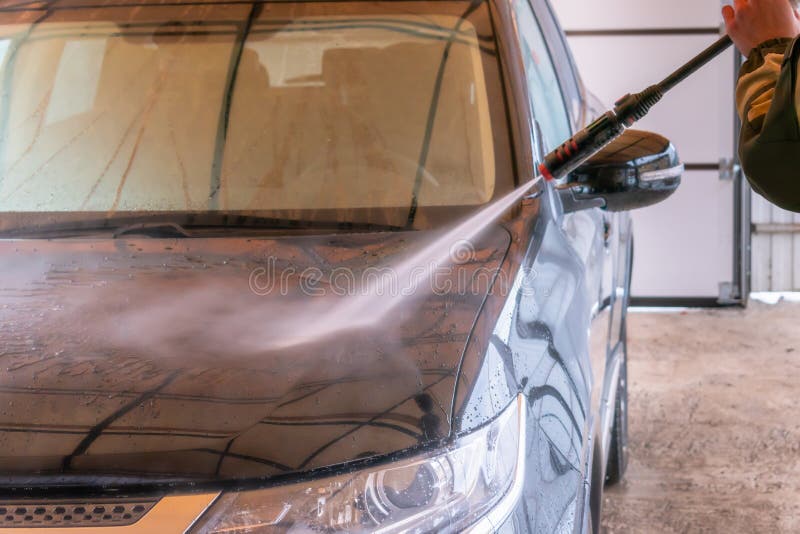 Car Wash with Karcher. the Man Washes the Black Car Stock Photo Image