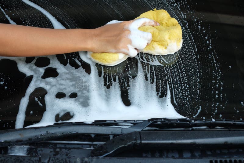 Outdoor car wash with active foam soap. commercial cleaning washing service  concept. Leave space to write messages. Stock Photo