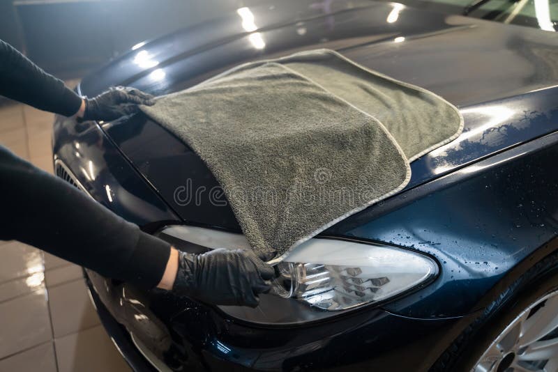 Worker Wipes a Liquid Disinfectant Railing Stairwells. Employee in Blue Uniform Treats Public