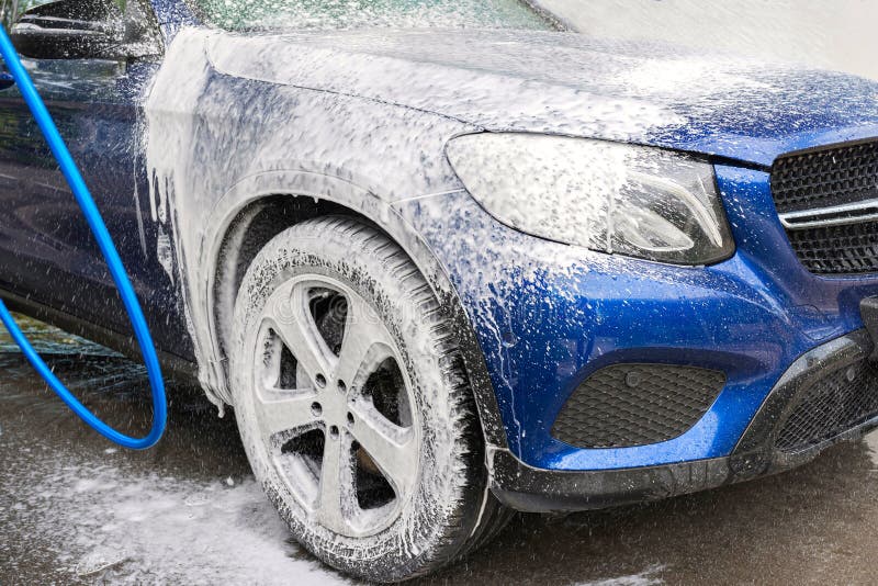 Car washing. Cleaning car using high pressure water royalty free stock images Car washing. Cleaning car using high pressure water royalty free stock images