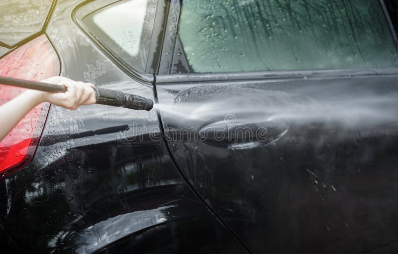 Car Washing. Cleaning Car Using High Pressure Water by woman,woman can wash concept,woman can do concept stock photo Car Washing. Cleaning Car Using High Pressure Water by woman,woman can wash concept,woman can do concept stock photo