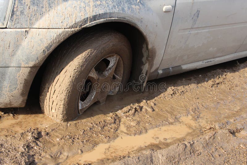 Car Wheel Stuck in Mud Slips in a Puddle on the Road Stock Image Image of extreme, vehicle