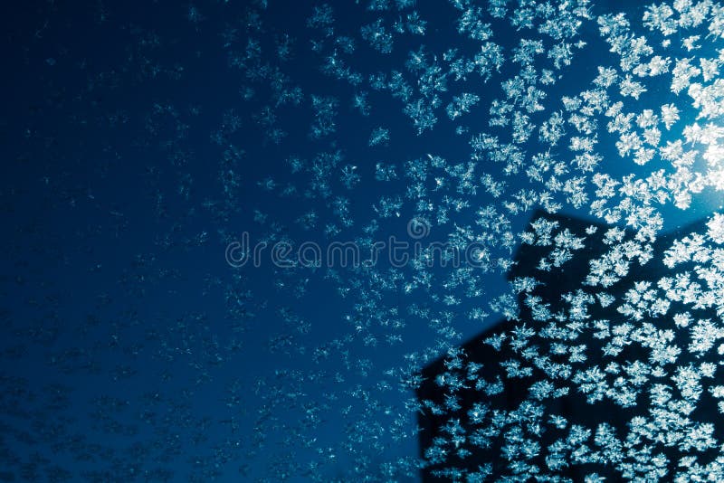 Car Windshield Covered in Ice Crystals on a Cold Winter Morning Stock