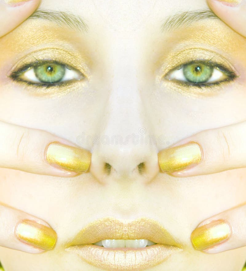 Cara de la mujer del oro imagen de archivo Cara de la mujer del oro imagen de archivo