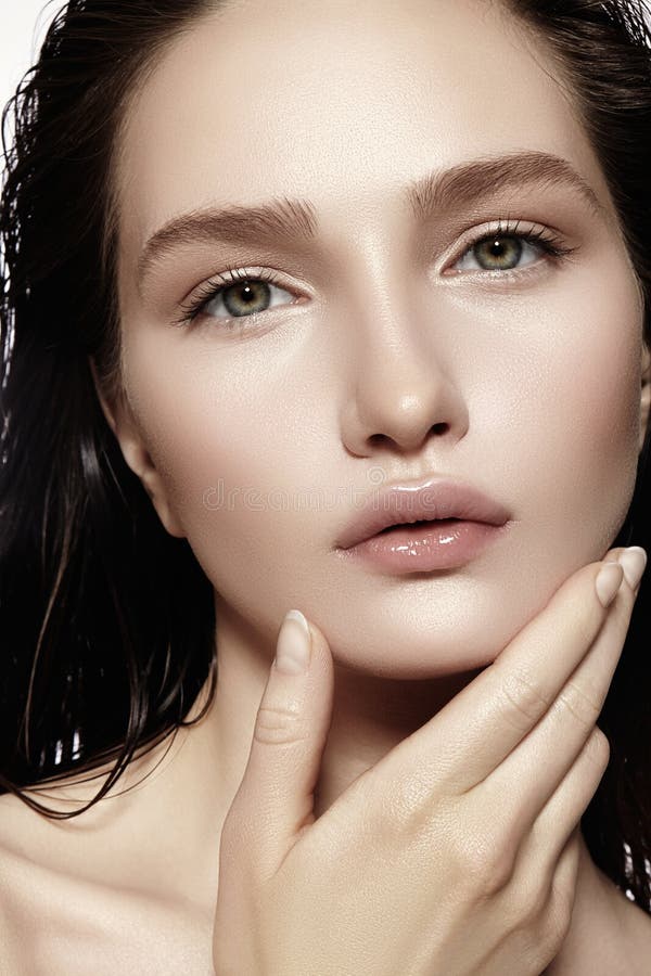 Beautiful Face of young Woman. Skincare, Wellness, Spa. Clean soft Skin, healthy Fresh look. Natural daily makeup, wet hair style. Beautiful Face of young Woman. Skincare, Wellness, Spa. Clean soft Skin, healthy Fresh look. Natural daily makeup, wet hair style