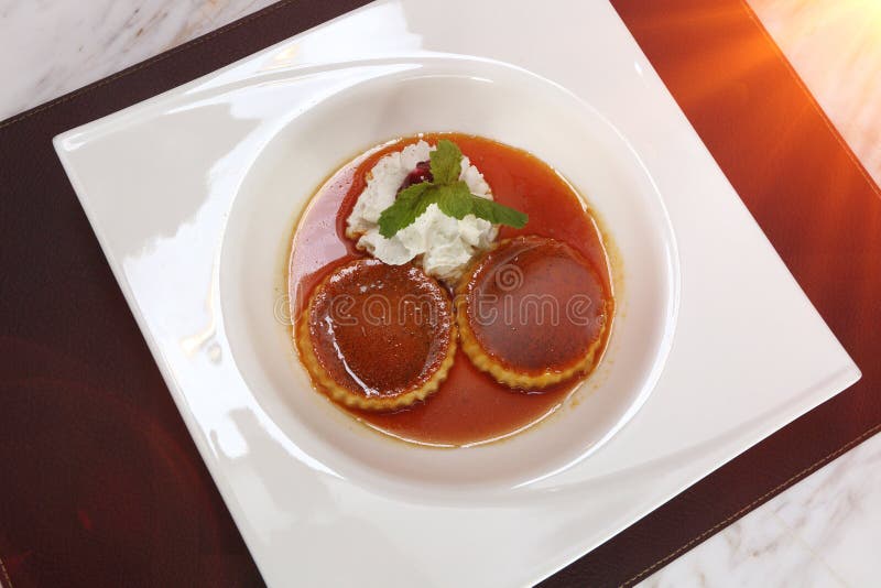 Caramel Custard Pudding with Mint Leave, Style Luxury Restaurant Stock
