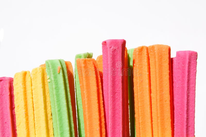 Fruit sticks candy over white background. Fruit sticks candy over white background