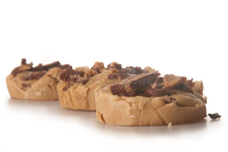 Shot of several slices of peanut butter fudge over white. Shot of several slices of peanut butter fudge over white.