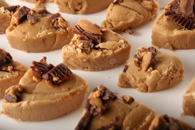 Shot of several slices of peanut butter fudge over white. Shot of several slices of peanut butter fudge over white.