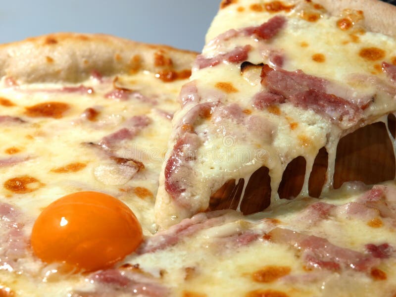 Carbonara Pizza with Egg and Bacon. Slice of Pizza with Cheese Stock