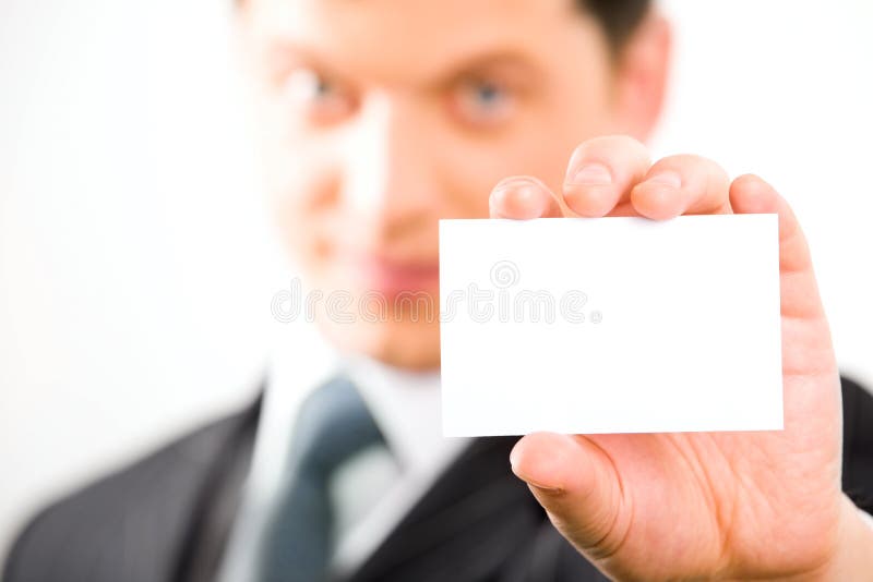 Close-up of white paper card in a businessman�s hand on the background of his face. Male hand holding businessman stock images, royalty-free photos and pictures