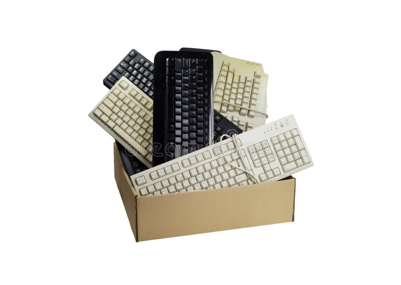 Cardboard box filled with used computer keyboards. Electronic trash.