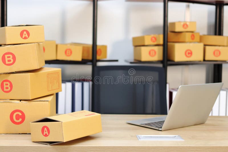 Cardboard Box on Workplace at Home. Start Up Small Business Stock Image