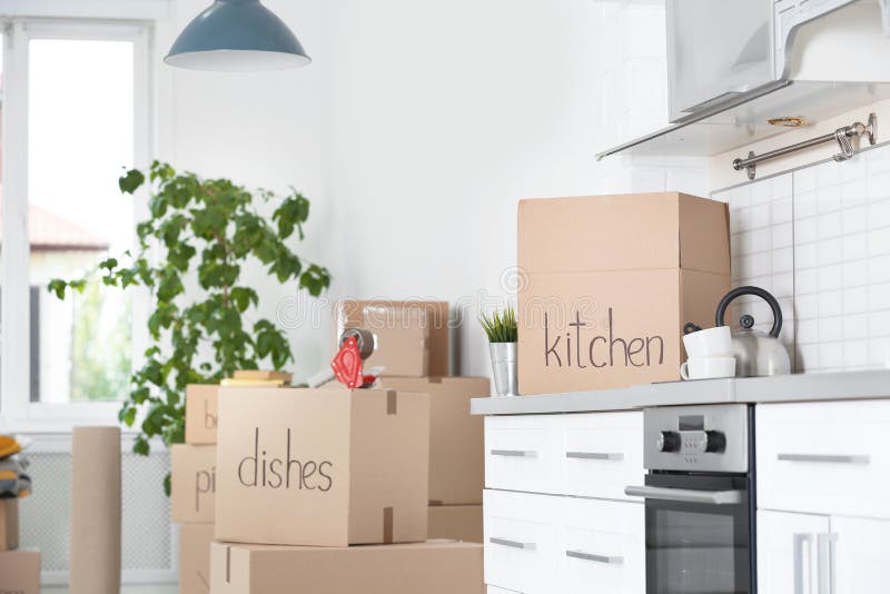 Cardboard Boxes and Household Stuff in Kitchen Stock Image Image of