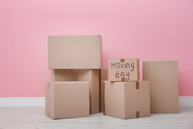Cardboard Boxes Near Color Wall Stock Photo - Image of loan, pink