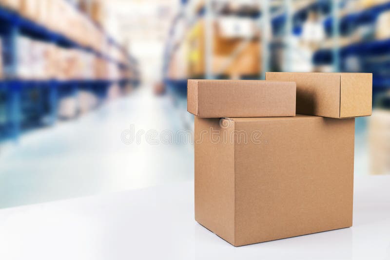 Cardboard boxes on the table in warehouse with copy space royalty free stock photo