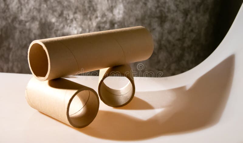 Cardboard bushings stacked on top of each other. The play of shadows and light.