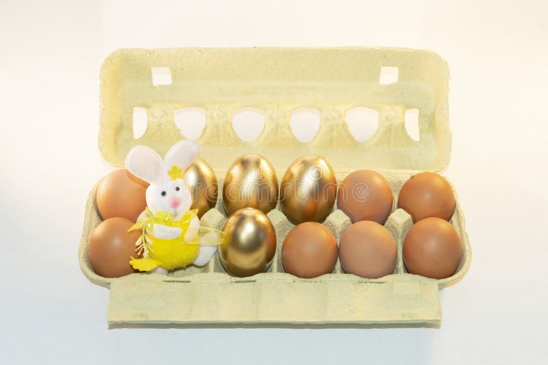 Cardboard paper tray with painted eggs. Pack with decorative eggs for Easter. Egg box. Preparation