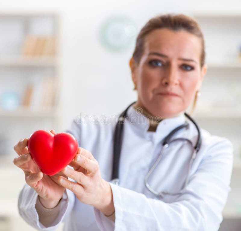 Cardiologist with Red Heart in Medical Concept Stock Image - Image of ...