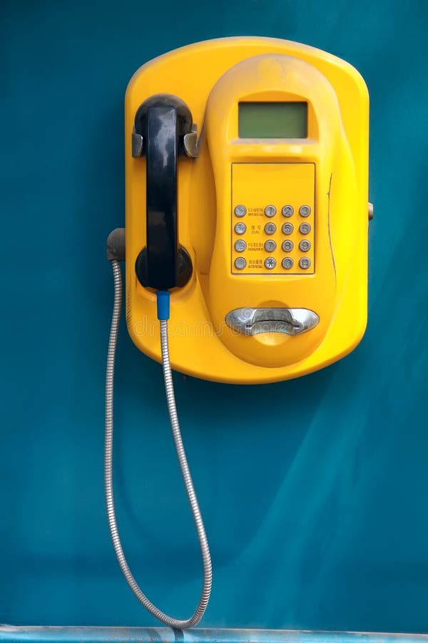 Yellow glass telephone booths with payphones are located on a pedestrian street. Obsolete means of telephone communication in free access. Bialystok Stock Photo - Alamy