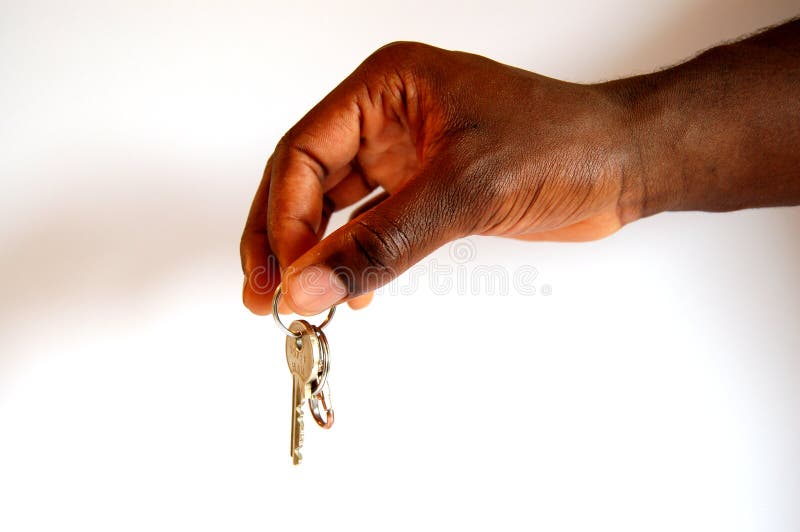 Black hand holding keys, white background. (Please let me know where the image will be used by leaving a message in the Comments Section/See Portfolio). Black hand holding keys, white background. (Please let me know where the image will be used by leaving a message in the Comments Section/See Portfolio)