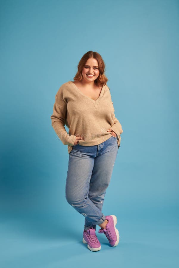 Carefree Curvy Girl with Hands in Pocket Posing at Studio Stock Photo -  Image of curvy, gorgeous: 117198330