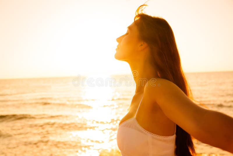Free happy woman enjoying sunset Stock Photo by ©Maridav 26073829