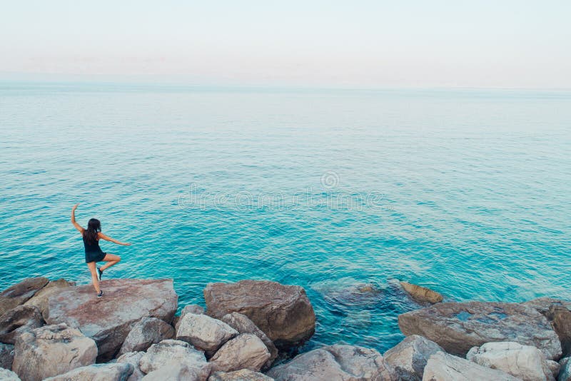 Carefree woman meditating in nature.Finding inner peace.Yoga practice.Spiritual healing lifestyle.Enjoying peace,anti-stress stock photography Carefree woman meditating in nature.Finding inner peace.Yoga practice.Spiritual healing lifestyle.Enjoying peace,anti-stress stock photography
