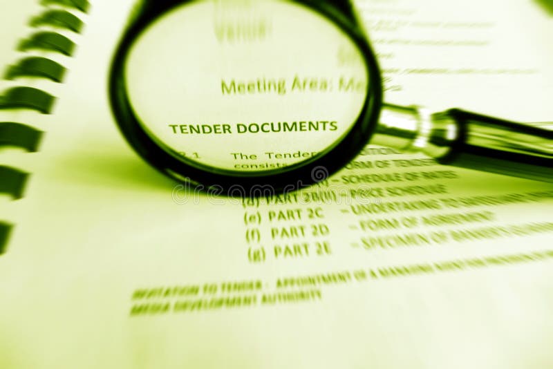 A photograph showing a magnifying glass used to focus upon the words tender documents, in a commercial business contract document. Radial zoom blurring applied to give a feel of energy and vibrancy and to help concentrate on the key title words. Business conceptual image. Horizontal format. A photograph showing a magnifying glass used to focus upon the words tender documents, in a commercial business contract document. Radial zoom blurring applied to give a feel of energy and vibrancy and to help concentrate on the key title words. Business conceptual image. Horizontal format.