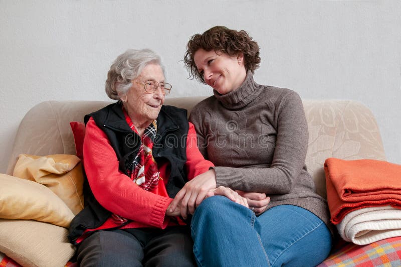 Caregiver holding hand of senior woman royalty free stock photos Caregiver holding hand of senior woman royalty free stock photos