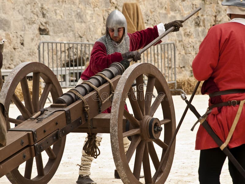 MDINA, MALTA - APR19 - Knights firing a cannon in the old city of Mdina in Malta April 19, 2009. MDINA, MALTA - APR19 - Knights firing a cannon in the old city of Mdina in Malta April 19, 2009