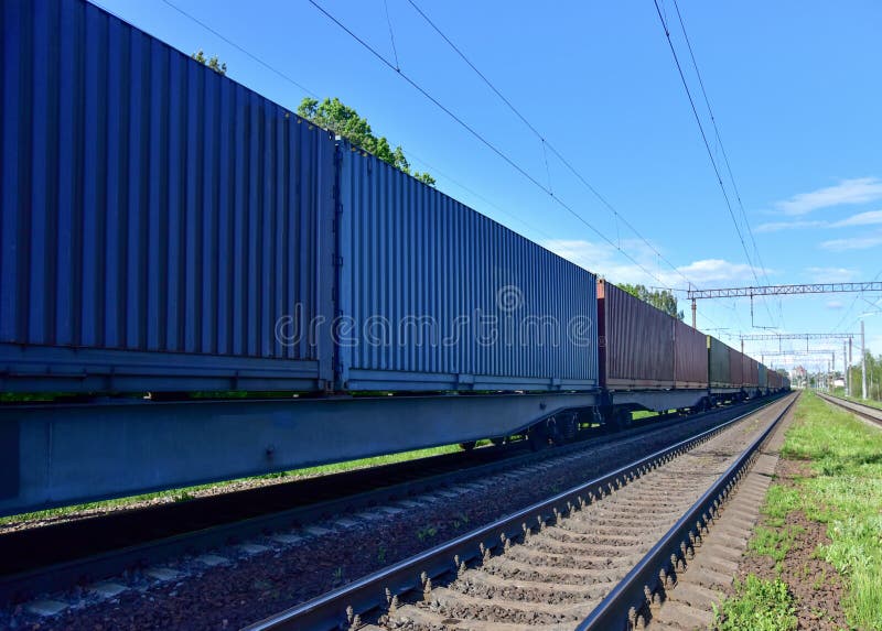 Cargo Containers Transportation on Freight Train by Railway. Intermodal