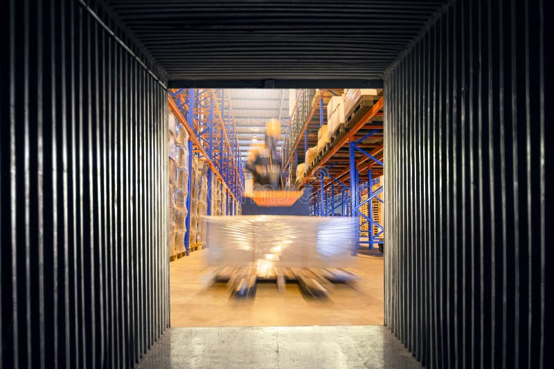 Cargo freight transportation. Logistic concept, Internal view an empty container shipping, forklift loading shipment pallet goods royalty free stock photography