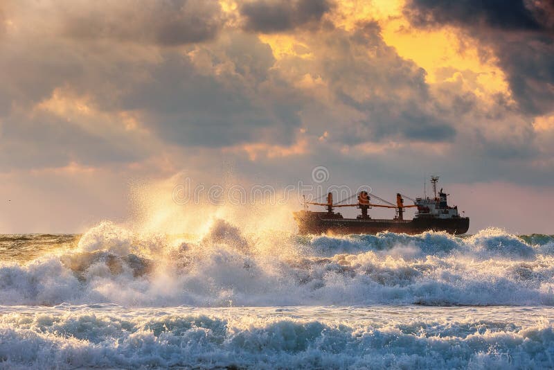 Cargo ship with containers in sunrise light royalty free stock photo