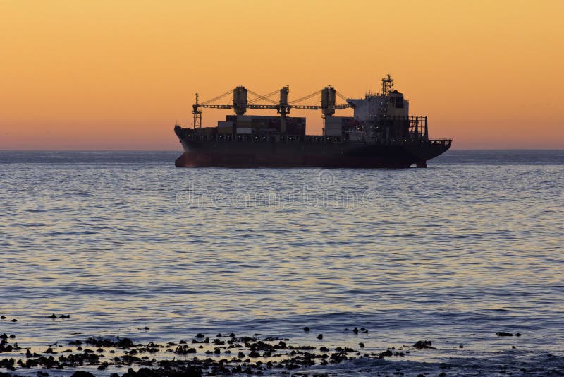 Cargo ship at sunset