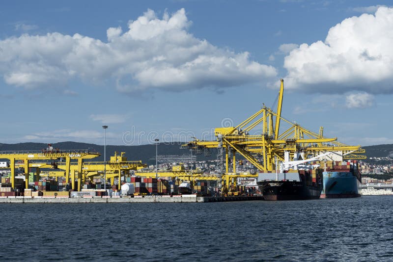Cargo ships docked at Pier VII of the Port of Trieste loading:unloading containers royalty free stock images
