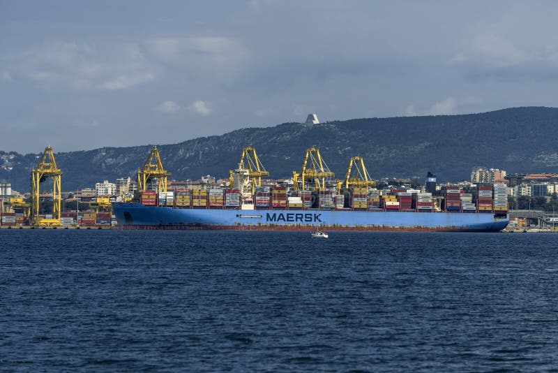 Cargo ships docked at Pier VII of the Port of Trieste loading:unloading containers royalty free stock image
