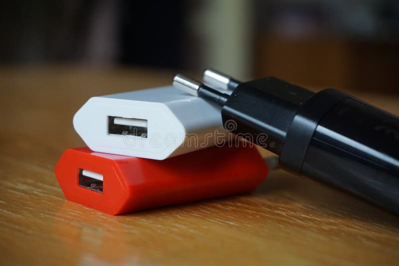 Colorful power chargers with USB (Universal Serial Bus) connectors for a power point. Colorful power chargers with USB (Universal Serial Bus) connectors for a power point