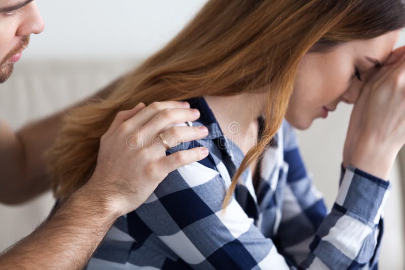 Caring husband comforting apologizing upset offended wife giving love support royalty free stock photography Caring husband comforting apologizing upset offended wife giving love support royalty free stock photography