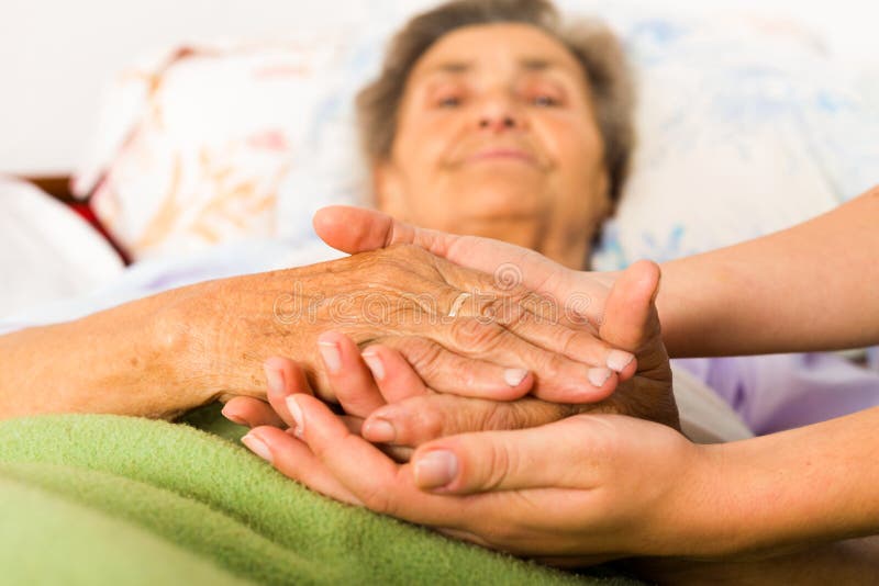 Caring Nurse Holding Hands stock photos Caring Nurse Holding Hands stock photos