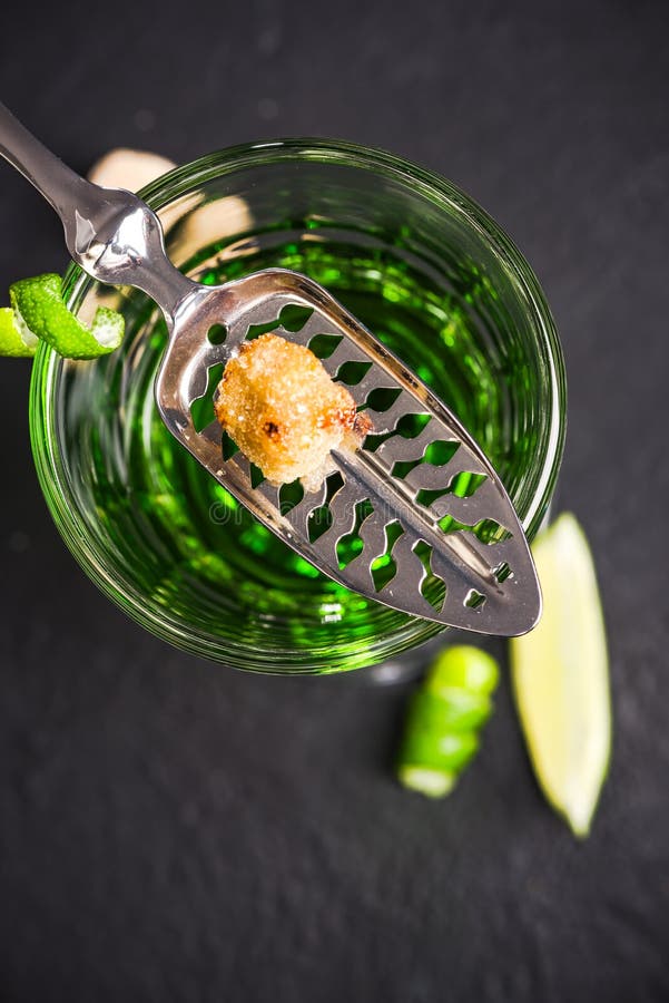 Carmelized Sugar Cube Over Green Absinthe Vodka Stock Image Image of