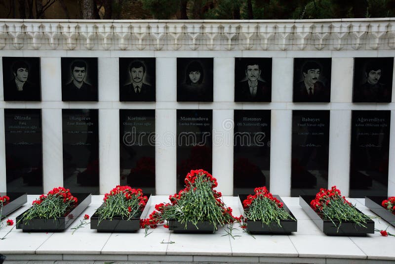 Carnations on graves of civilians killed in massacre in Baku