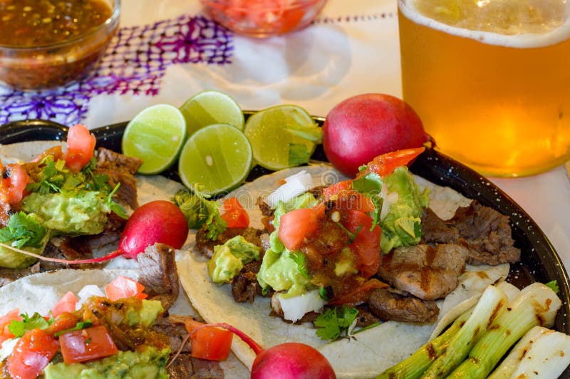 Carne Asada Tacos with Craft Beer and Condiments in Tijuana with Copy