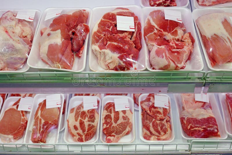 Packaged meat on supermarket shelves cooled. Packaged meat on supermarket shelves cooled