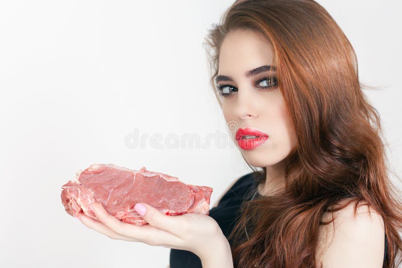 Image of woman holding packaged meat at the supermarket. Healthy eating. Meat recipes, expiration date, shelf life. Image of woman holding packaged meat at the supermarket. Healthy eating. Meat recipes, expiration date, shelf life