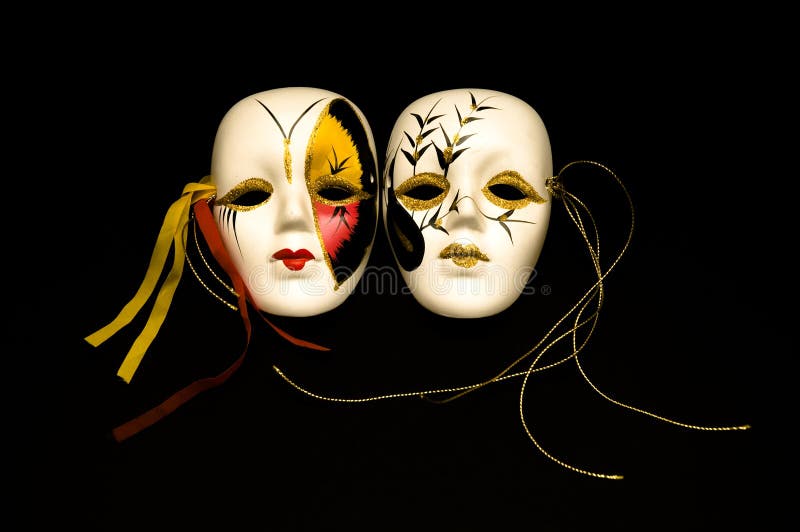 Two carnival masks isolated on black