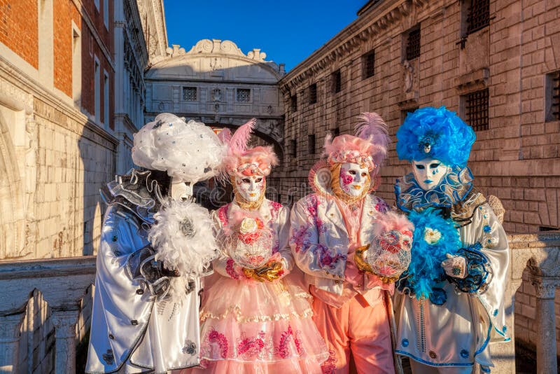 Carnival masks against famous Bridge of Sighs in Venice, Italy