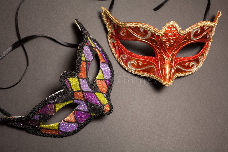 Carnival masks on gray background