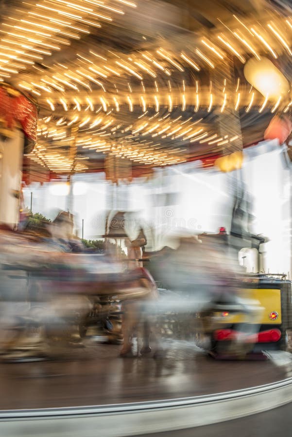 Carousel with horses in amusement park royalty free stock photography